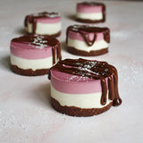 Lots of vegan Vanilla Berry Cheesecakes